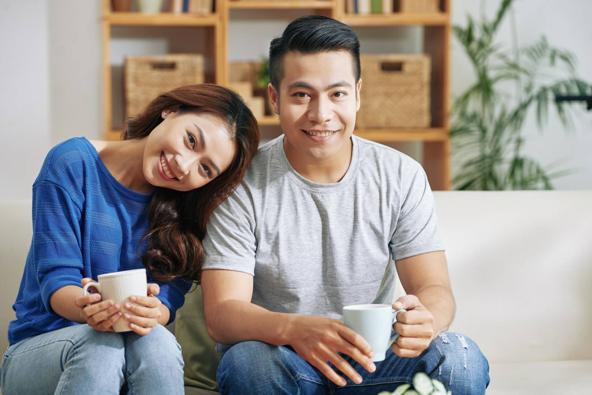 Asian Couple With Mugs